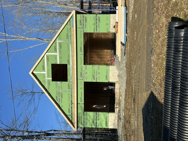 Newly built detached garage with carriage-style doors